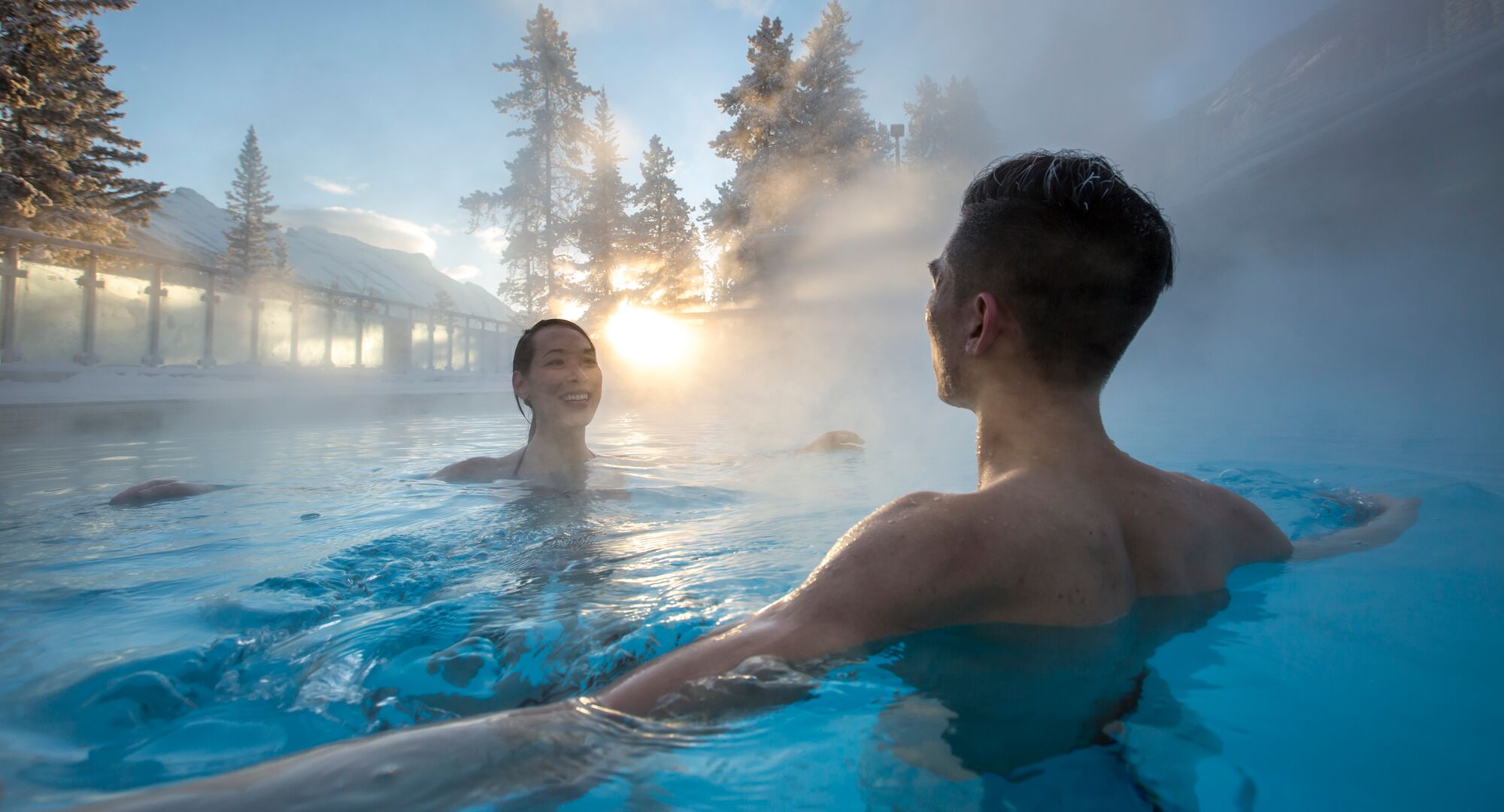 A couple enjoying the warmth of Banff Upper Hot Springs